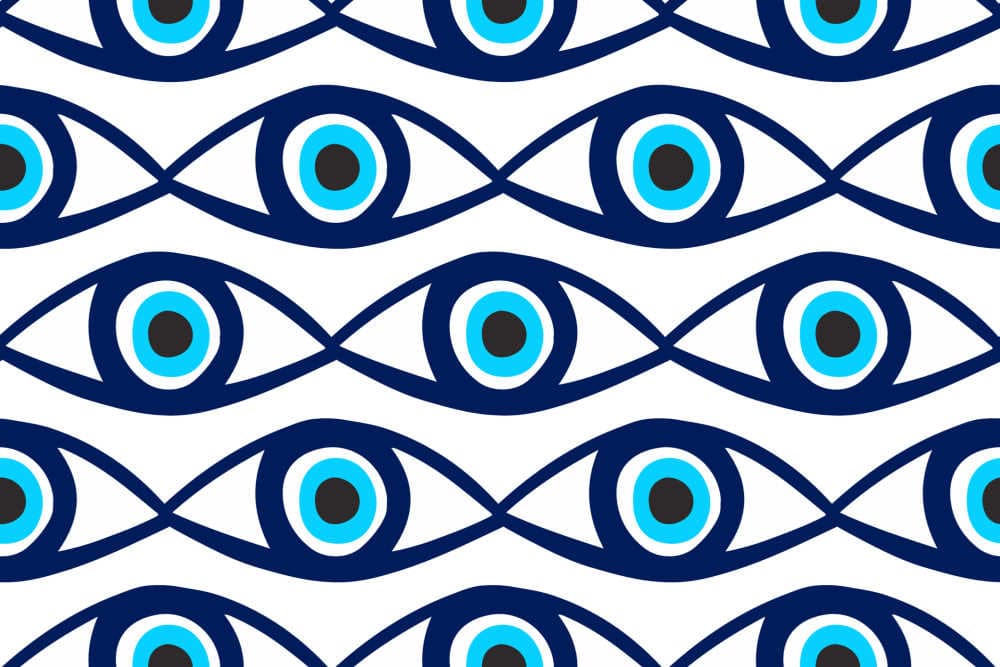 Image by Arina Ulyasheva via Shutterstock - seamless pattern with evil eyes